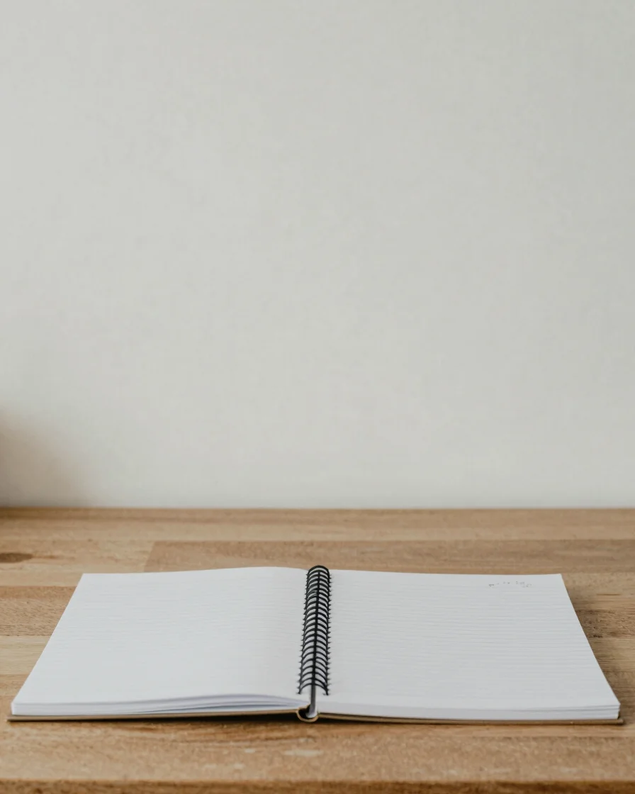 Neutral editorial documentary photograph, soft even daylight, restrained natural colors, a clear close detail of a desk